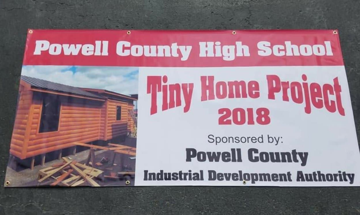 A banner for the powell county high school tiny home project