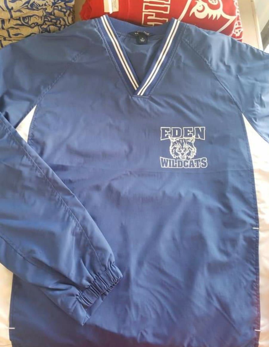 A blue shirt with the word eden on it
