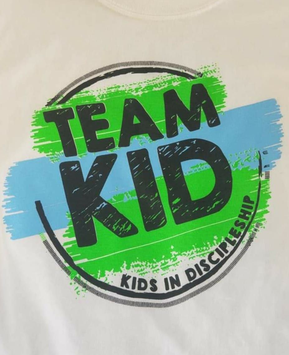 A shirt that says team kid kids in discipleship