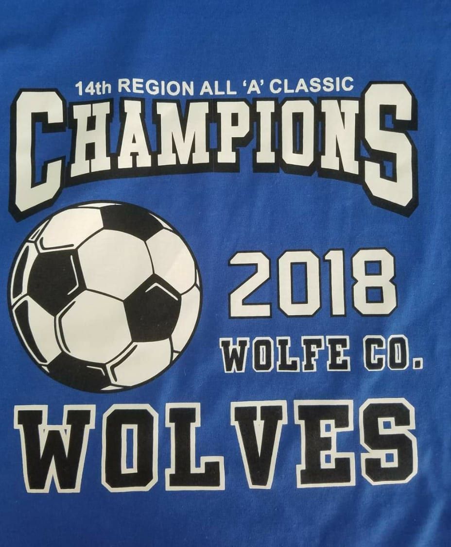 A blue shirt with the word wolves on it