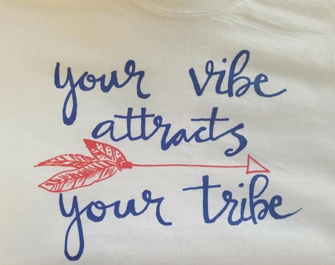 A shirt that says your vibe attracts your tribe