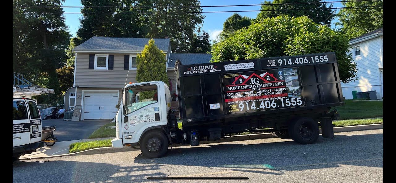 A garbage truck is parked in front of a house.