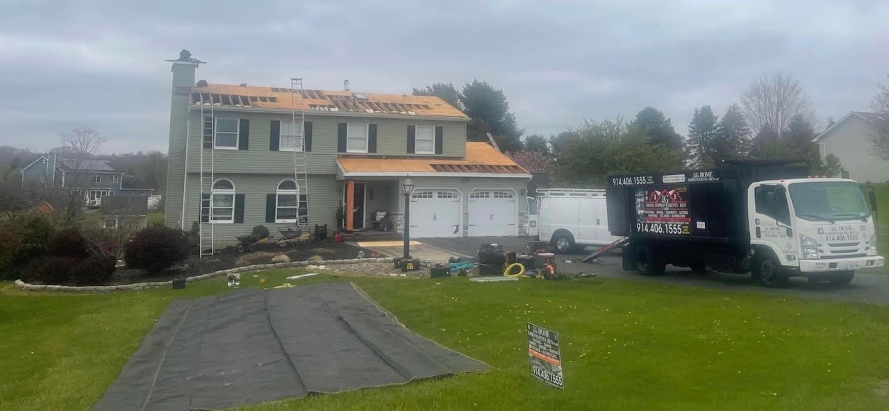 A house under construction with a truck parked in front of it.