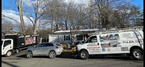 A couple of trucks parked next to each other in a parking lot.