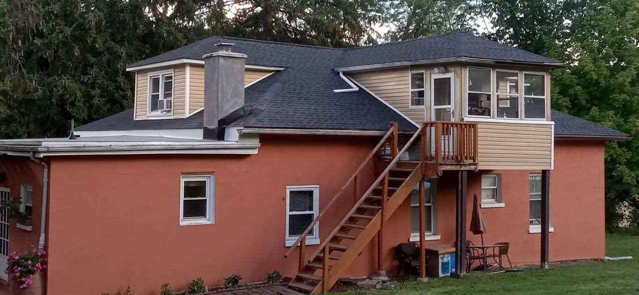 A large house with stairs leading up to the second floor