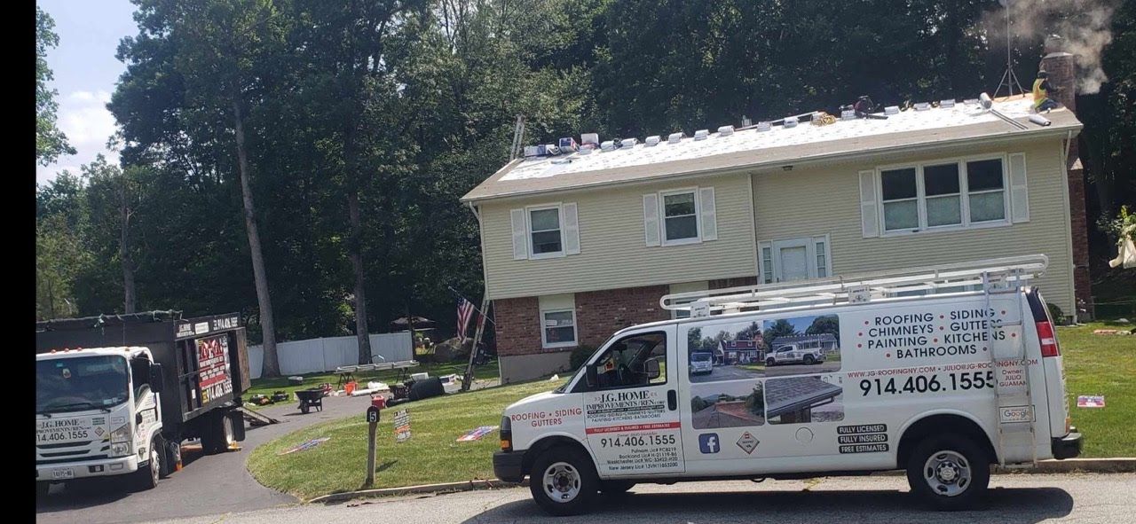 A white van is parked in front of a house.