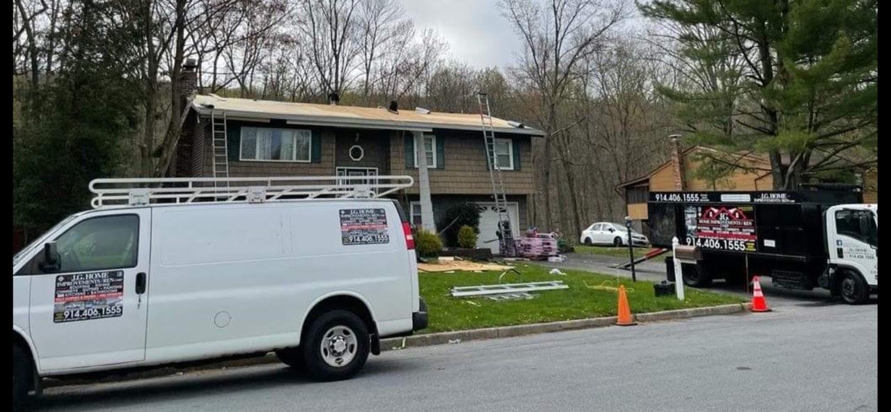A white van is parked in front of a house.