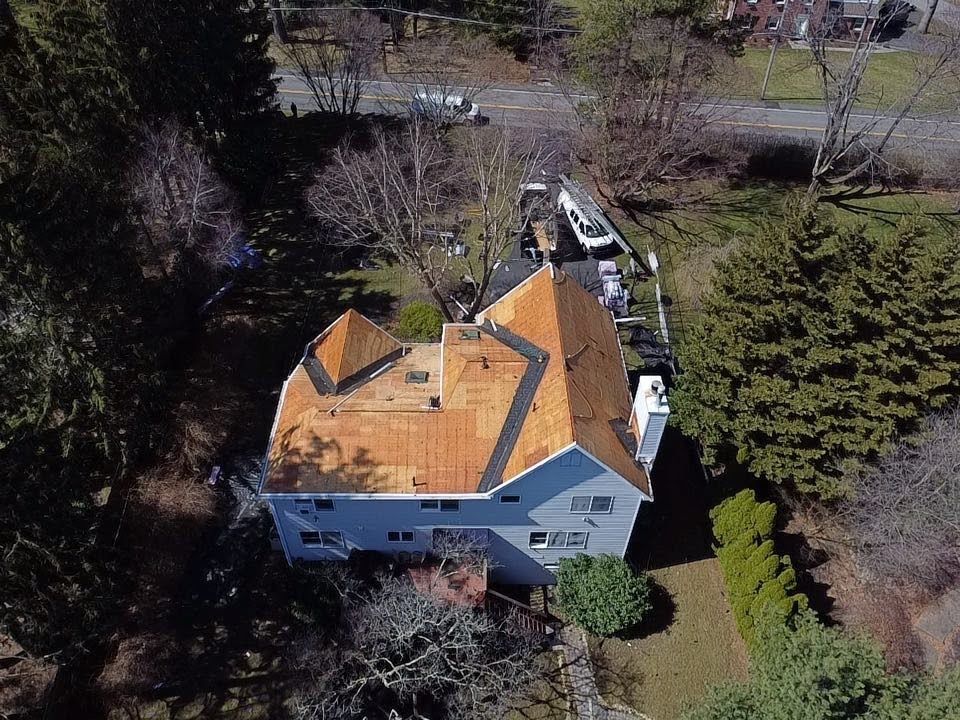 An aerial view of a house with a new roof