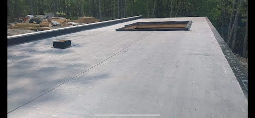 A roof with a hole in it and trees in the background.