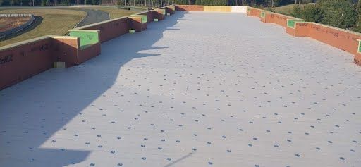 A white roof with a lot of holes in it