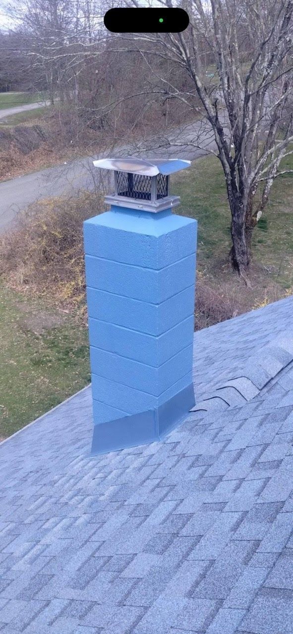 A blue chimney is sitting on top of a roof.