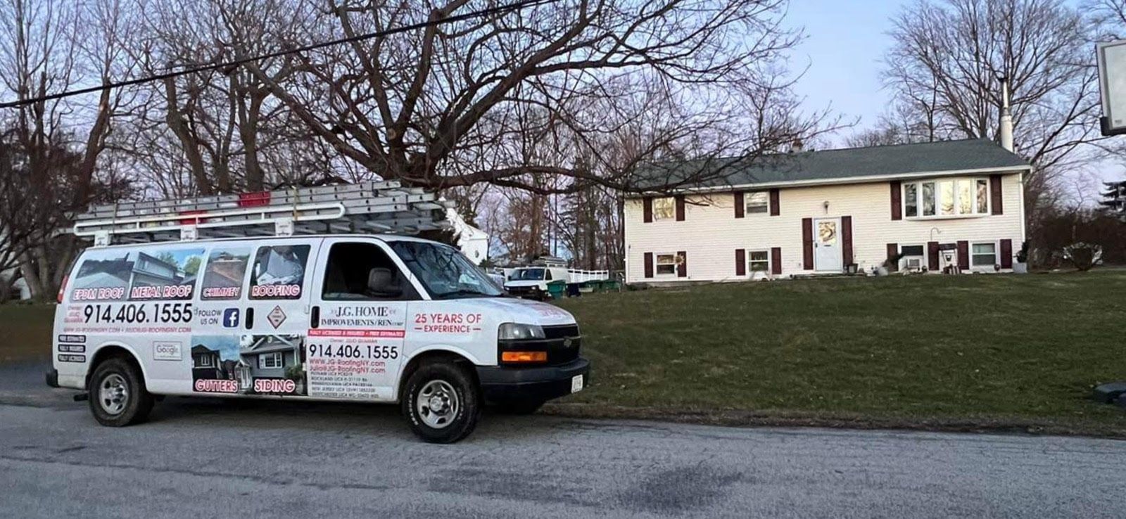 A white van is parked in front of a house