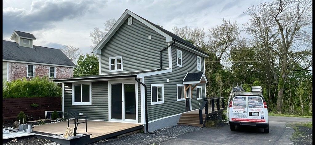 A house with a white van parked in front of it.