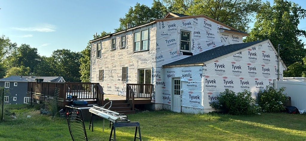A house with a lot of insulation on the side of it.