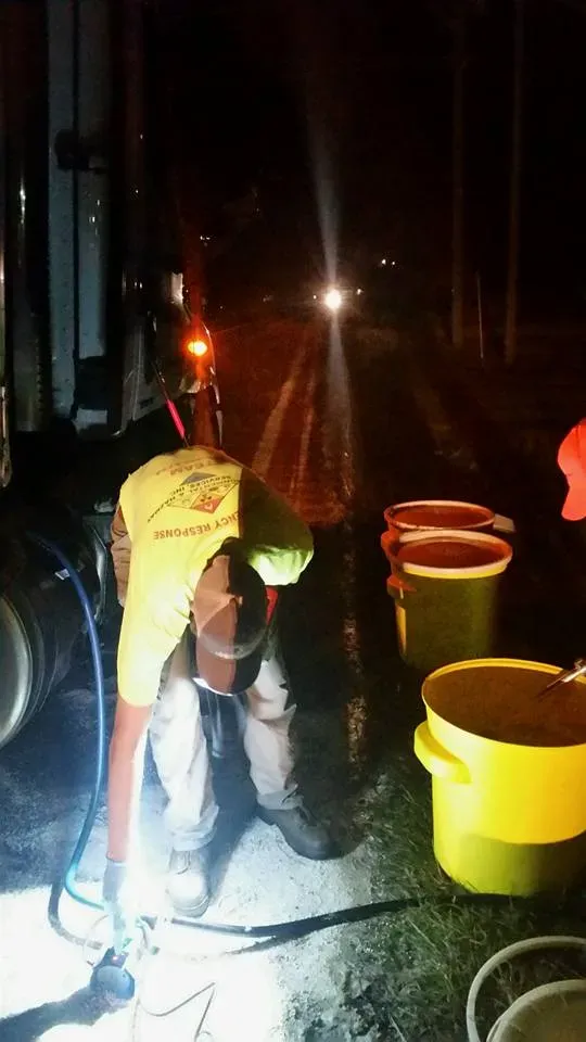 Man on yellow top and three buckets — Ashford, AL — Environmental & Hazmat Services Inc.