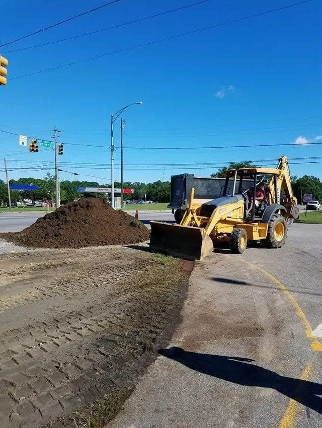 Excavator next to a pile of soil — Ashford, AL — Environmental & Hazmat Services Inc.