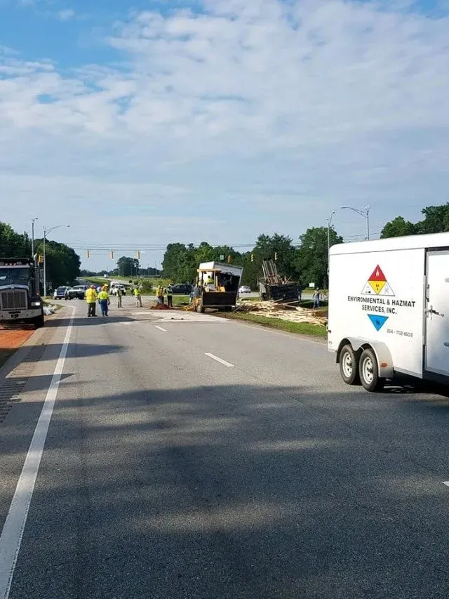 Road with trucks parked on the side — Ashford, AL — Environmental & Hazmat Services Inc.