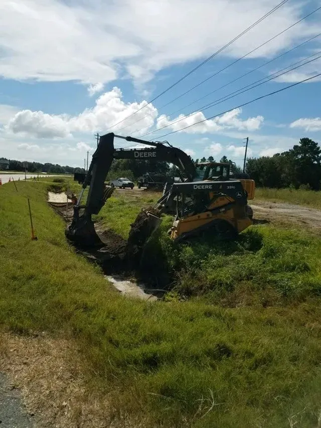 Excavator digging the ground — Ashford, AL — Environmental & Hazmat Services Inc.