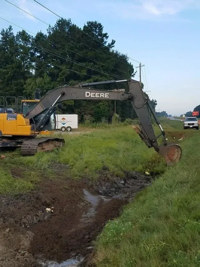 Close up of an excavator digging the ground — Ashford, AL — Environmental & Hazmat Services Inc.