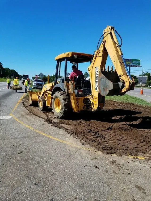 A person driving an excavator — Ashford, AL — Environmental & Hazmat Services Inc.
