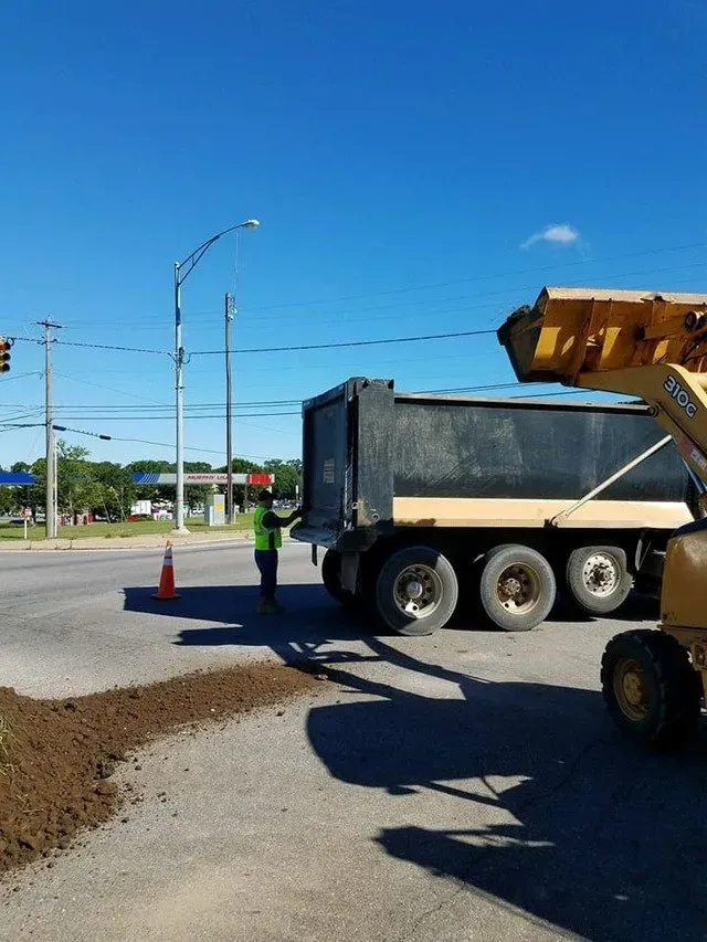 Black huge truck with the worker — Ashford, AL — Environmental & Hazmat Services Inc.
