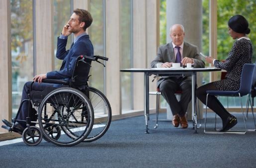 Man in wheelchair in office 