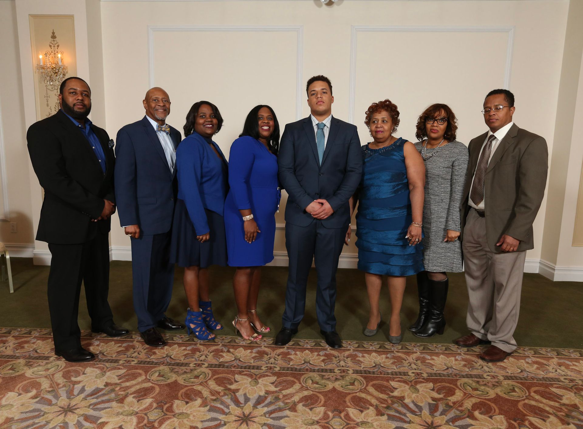 a group of people posing for a picture in a room