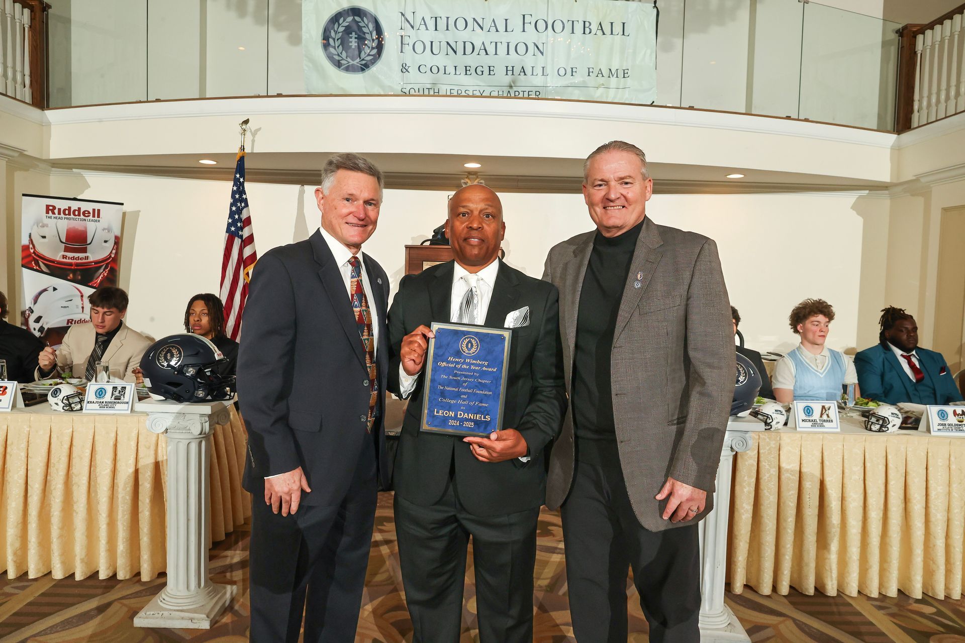 Henry Wimberg and Mike Gatley presenting an award to Leon Daniels