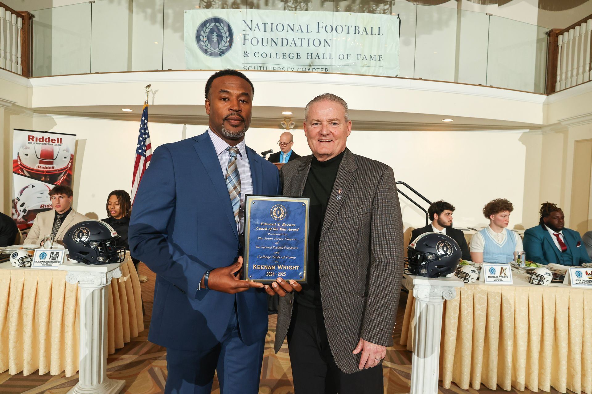 Mike Gatley presenting an award to keenan wright