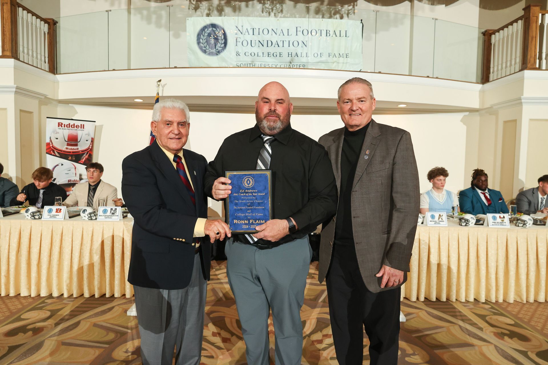 Tony Surace and Mike Gatley presenting an award to Ron Flaim