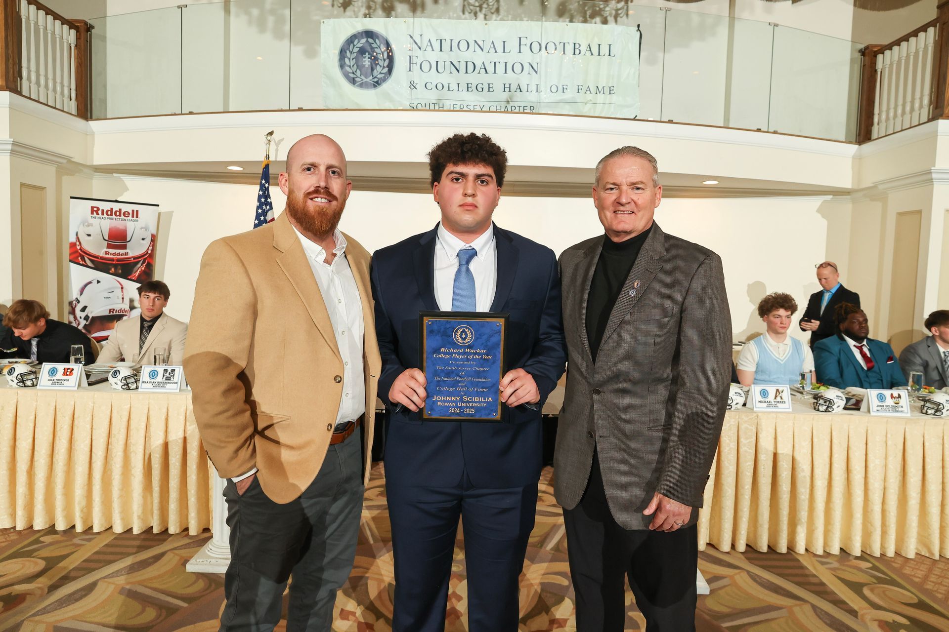 Mike Gatley presenting an award to John Scibilia