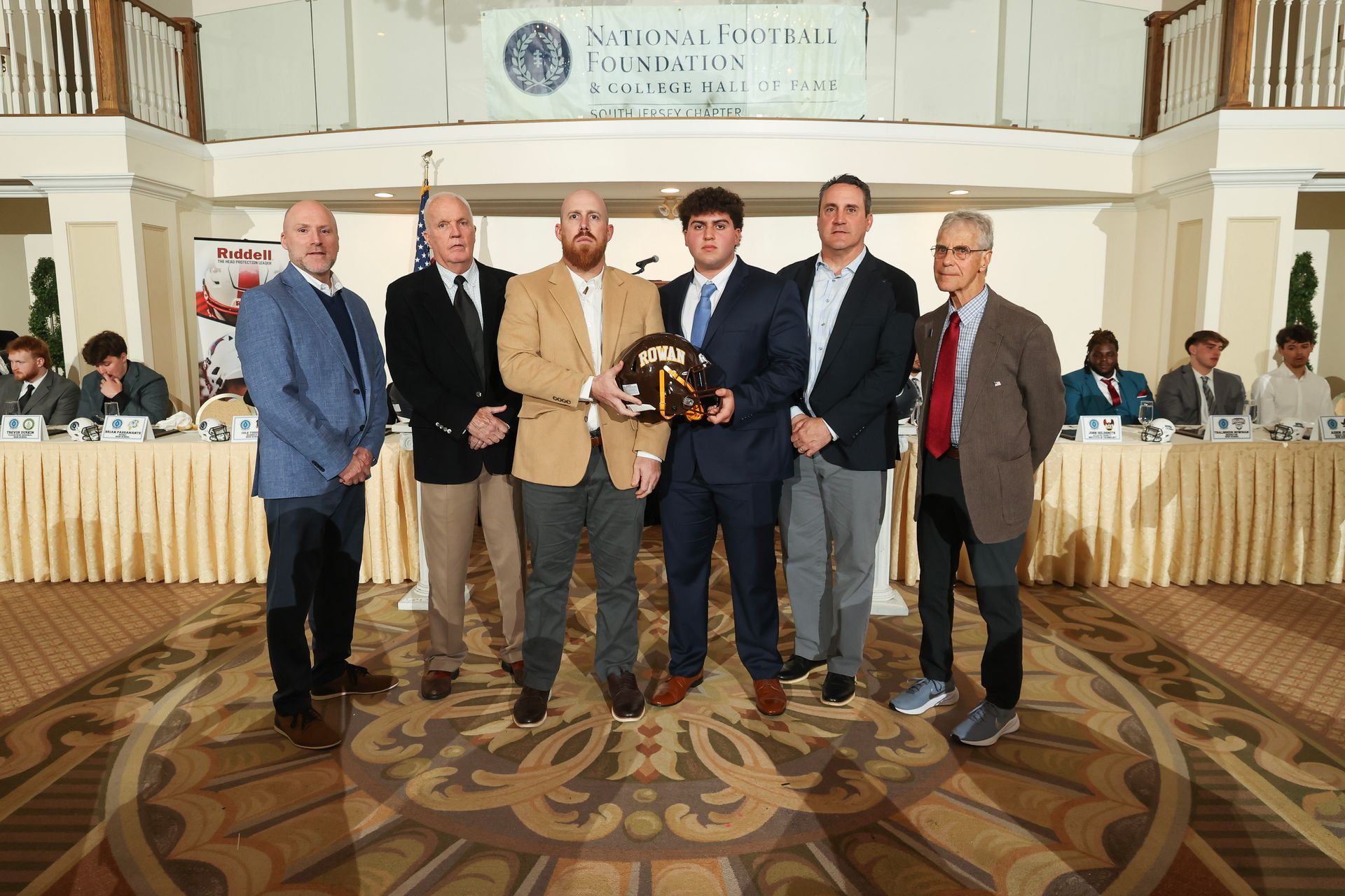 nffsj executive committee members presenting an award to john scibilia