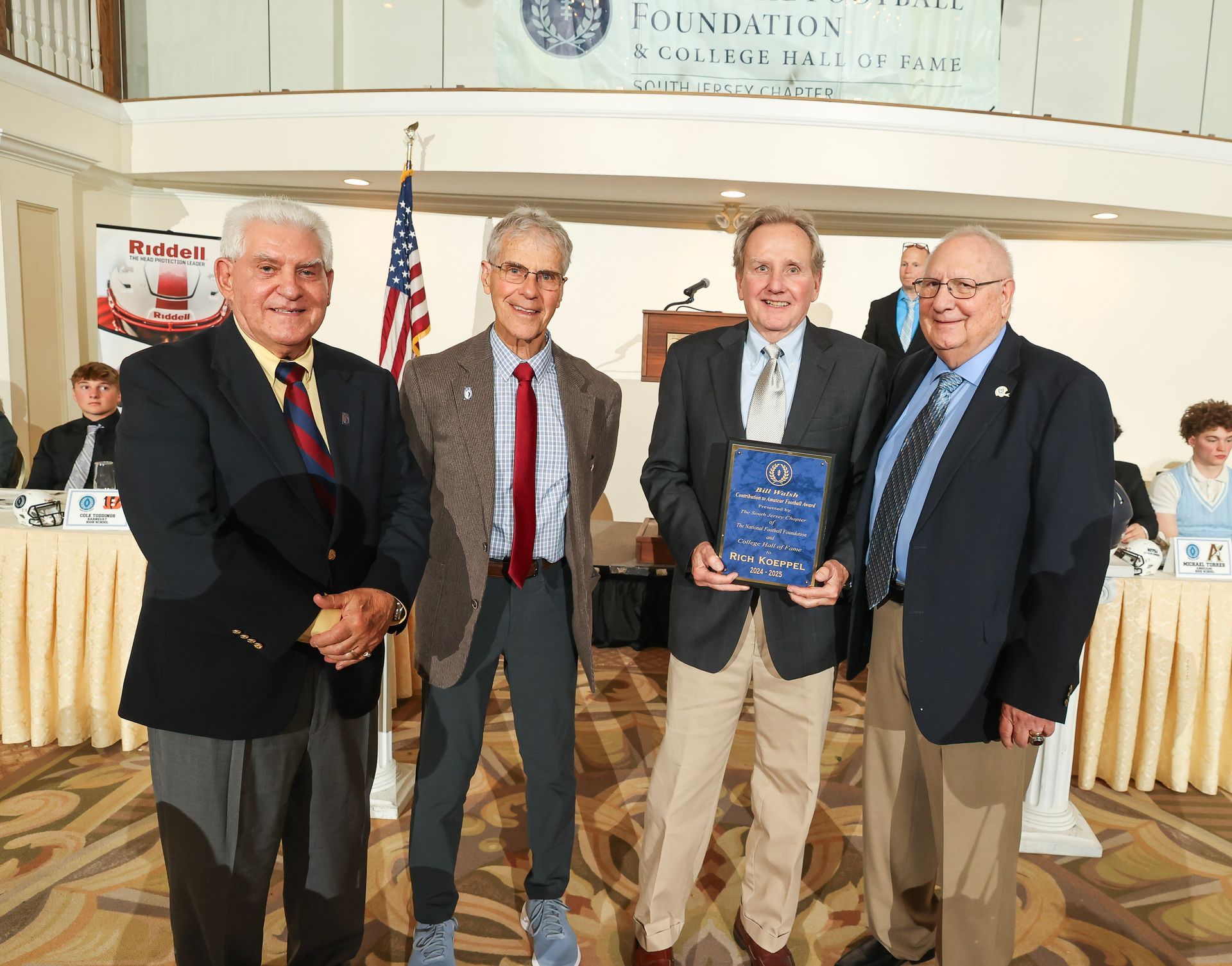 nffsj executive committee members presenting an award to rich koeppel