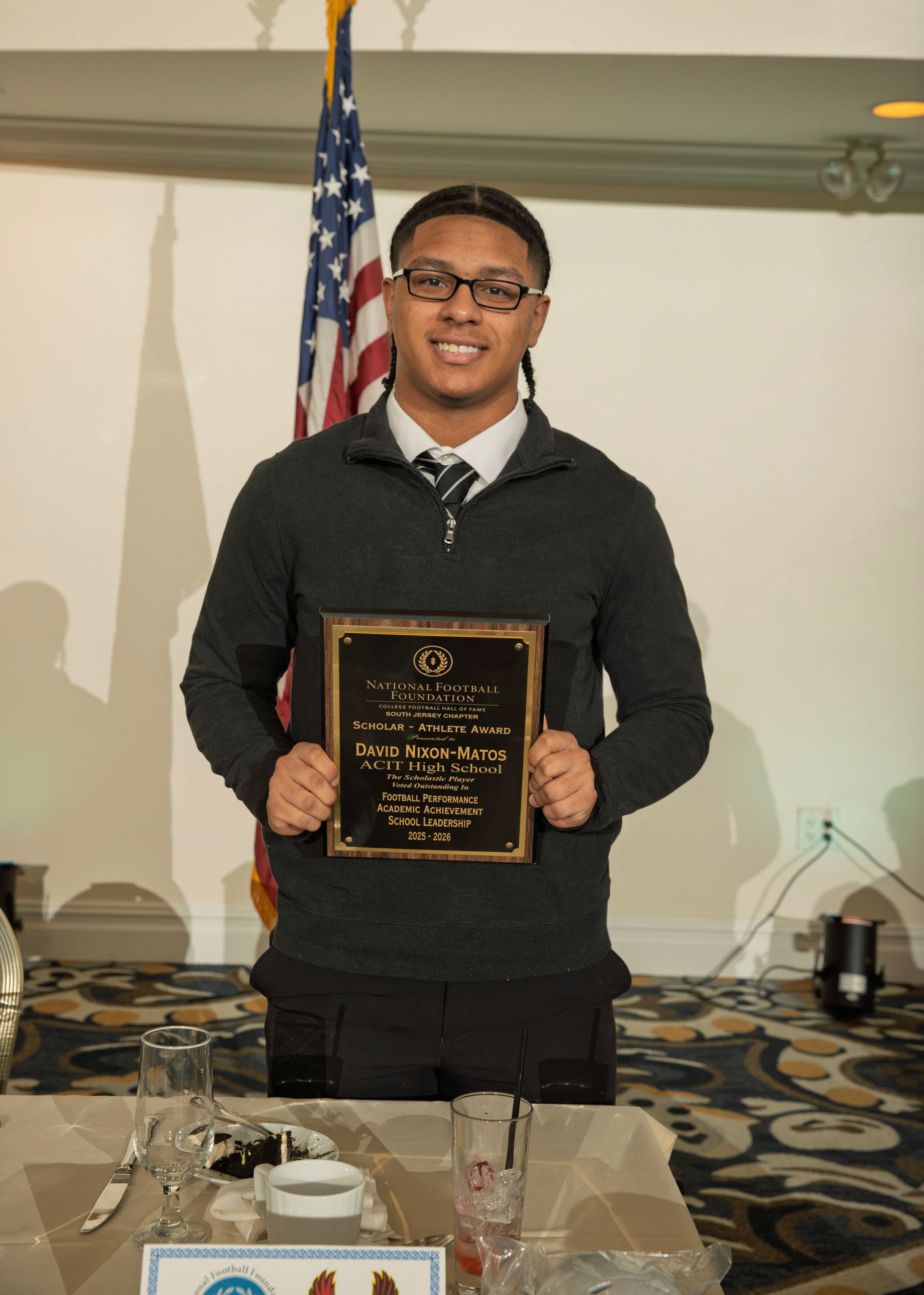 David Nixon-Matos from ACIT High School holding scholar-athlete awards plaque from NFFSJ