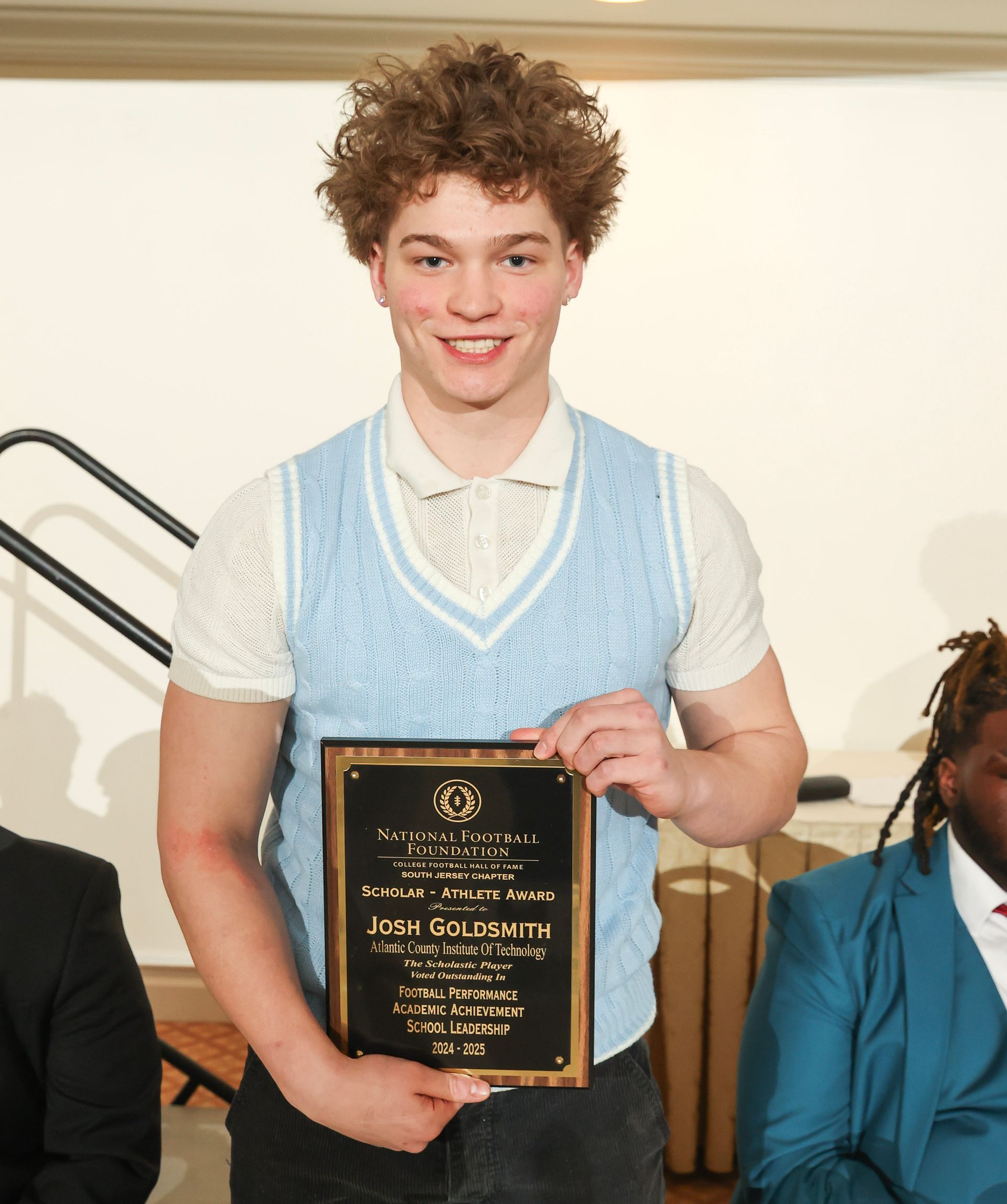 josh goldsmith of atlantic county institute of technology  holding an award plaque 
