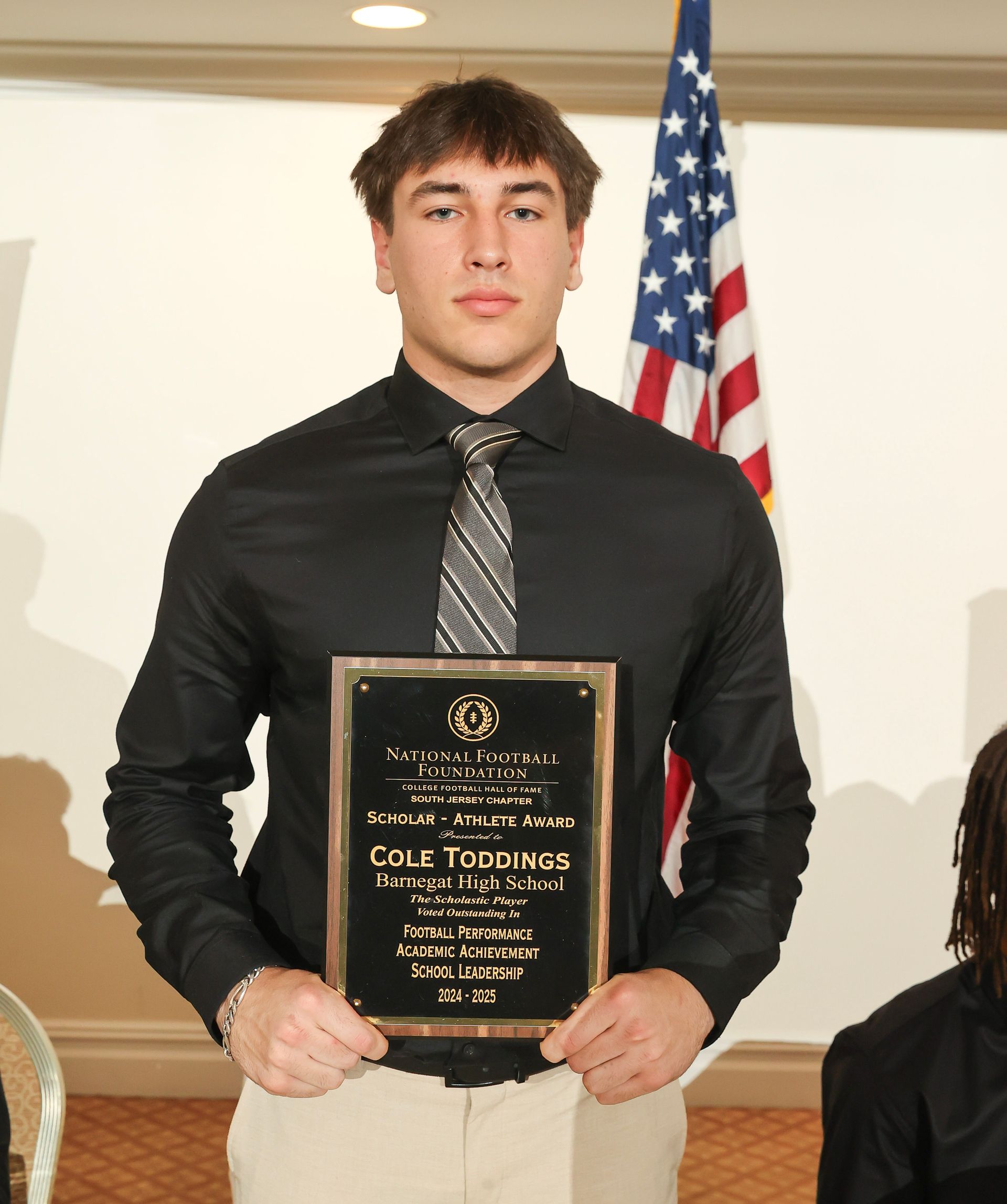 cole toddings of barnegat high school holding an award plaque 