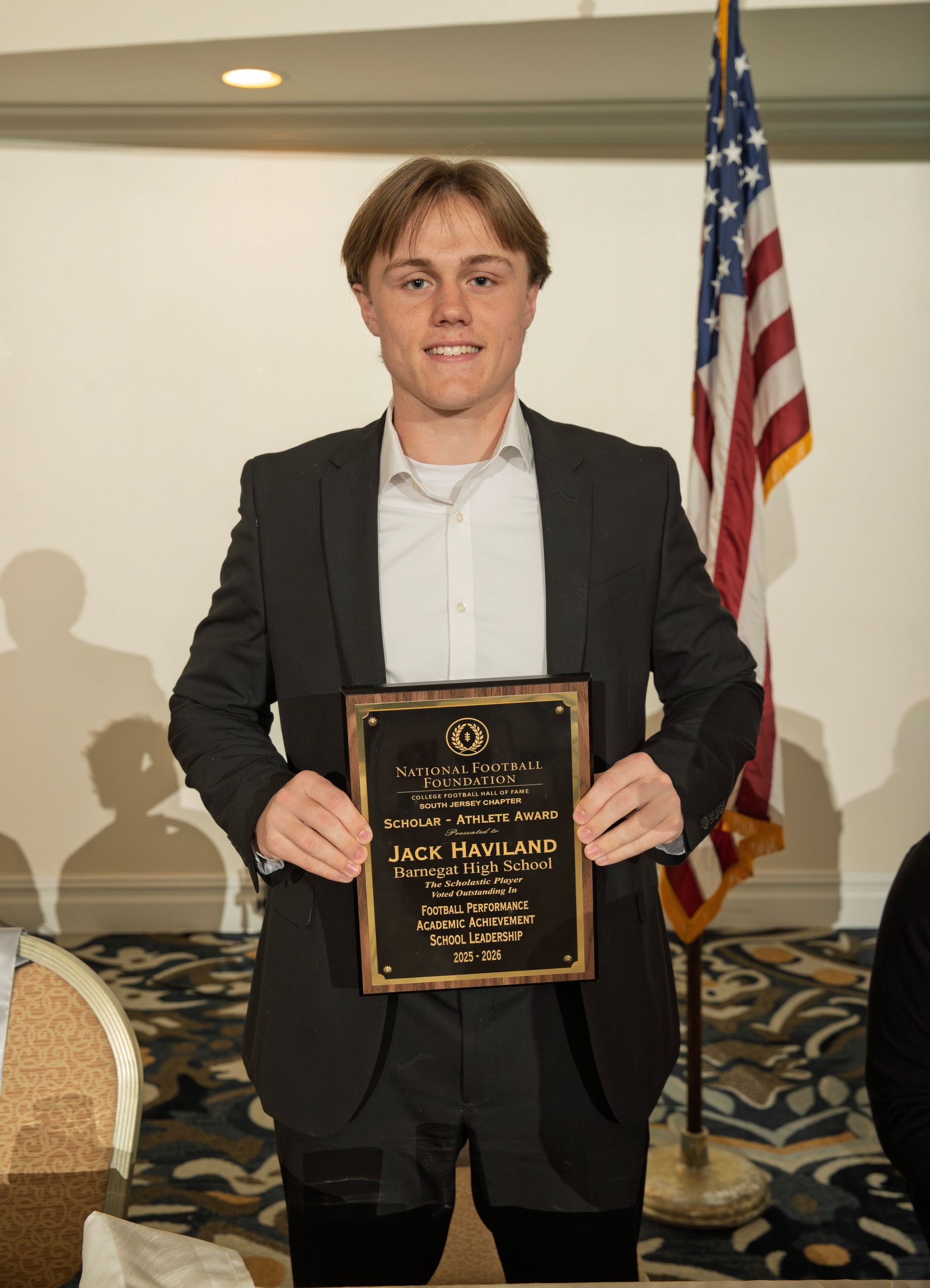 Jack Haviland from Barnegat High School holding scholar-athlete awards plaque from NFFSJ