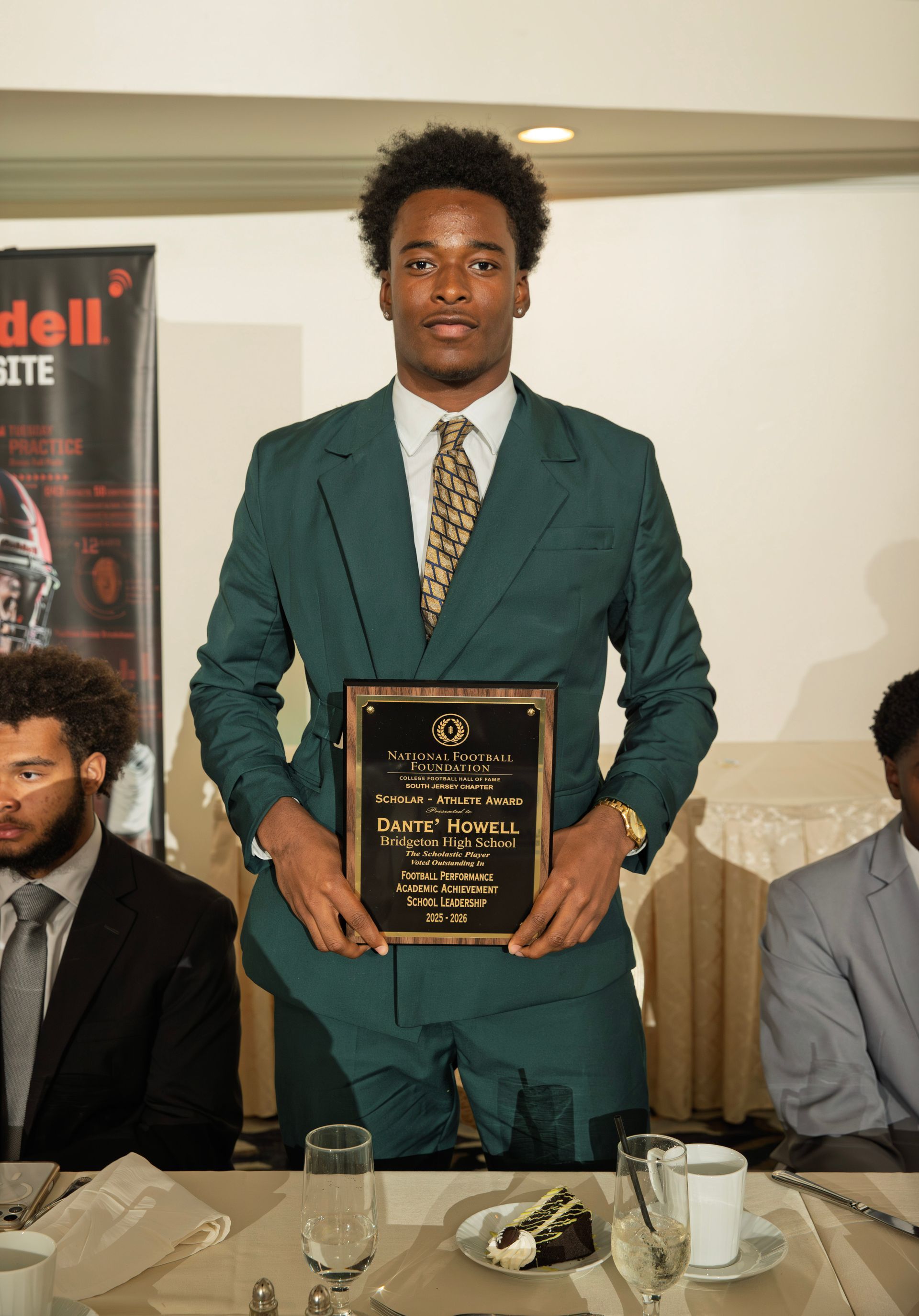 Dante Howell from Bridgeton High School holding scholar-athlete awards plaque from NFFSJ