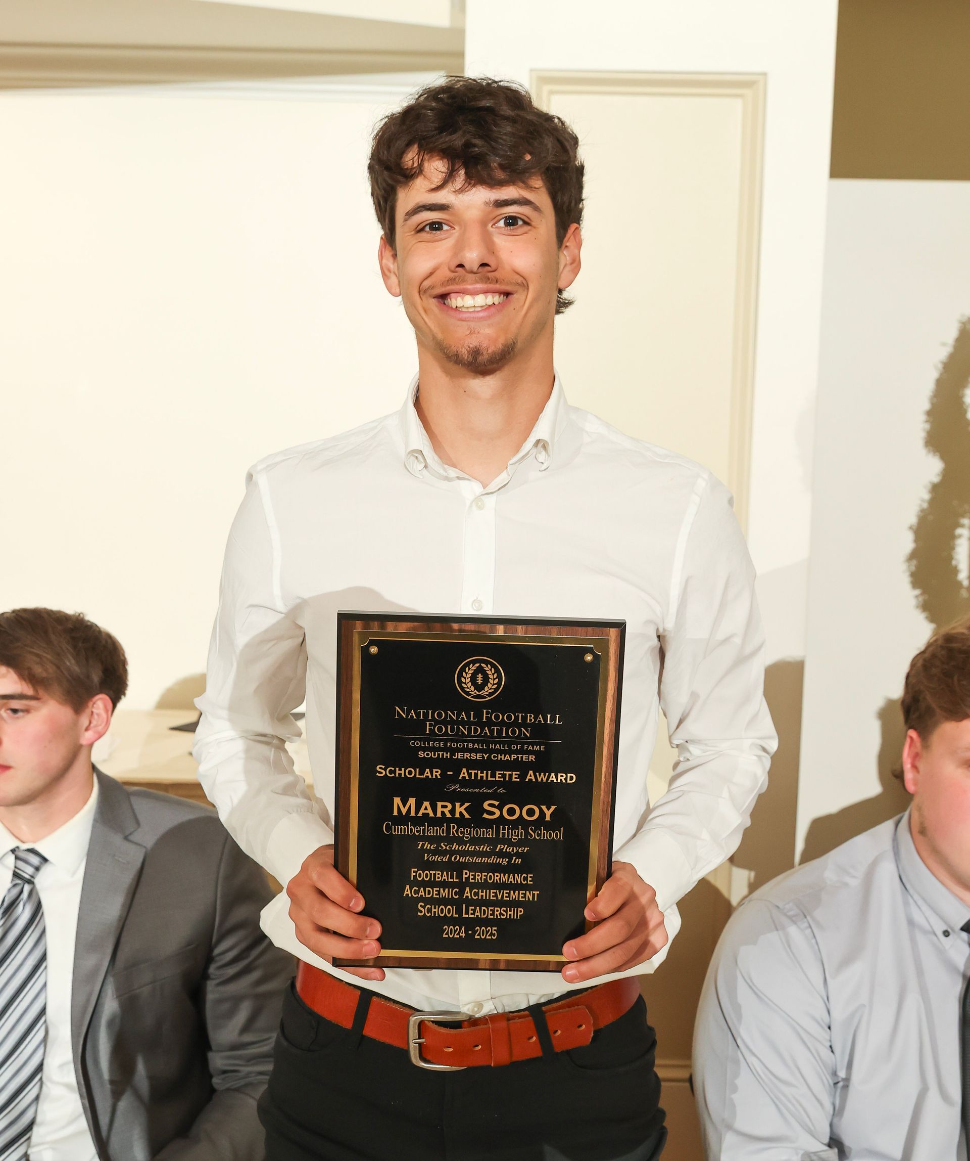 mark soy of cumberland regional high school holding an awards plaque
