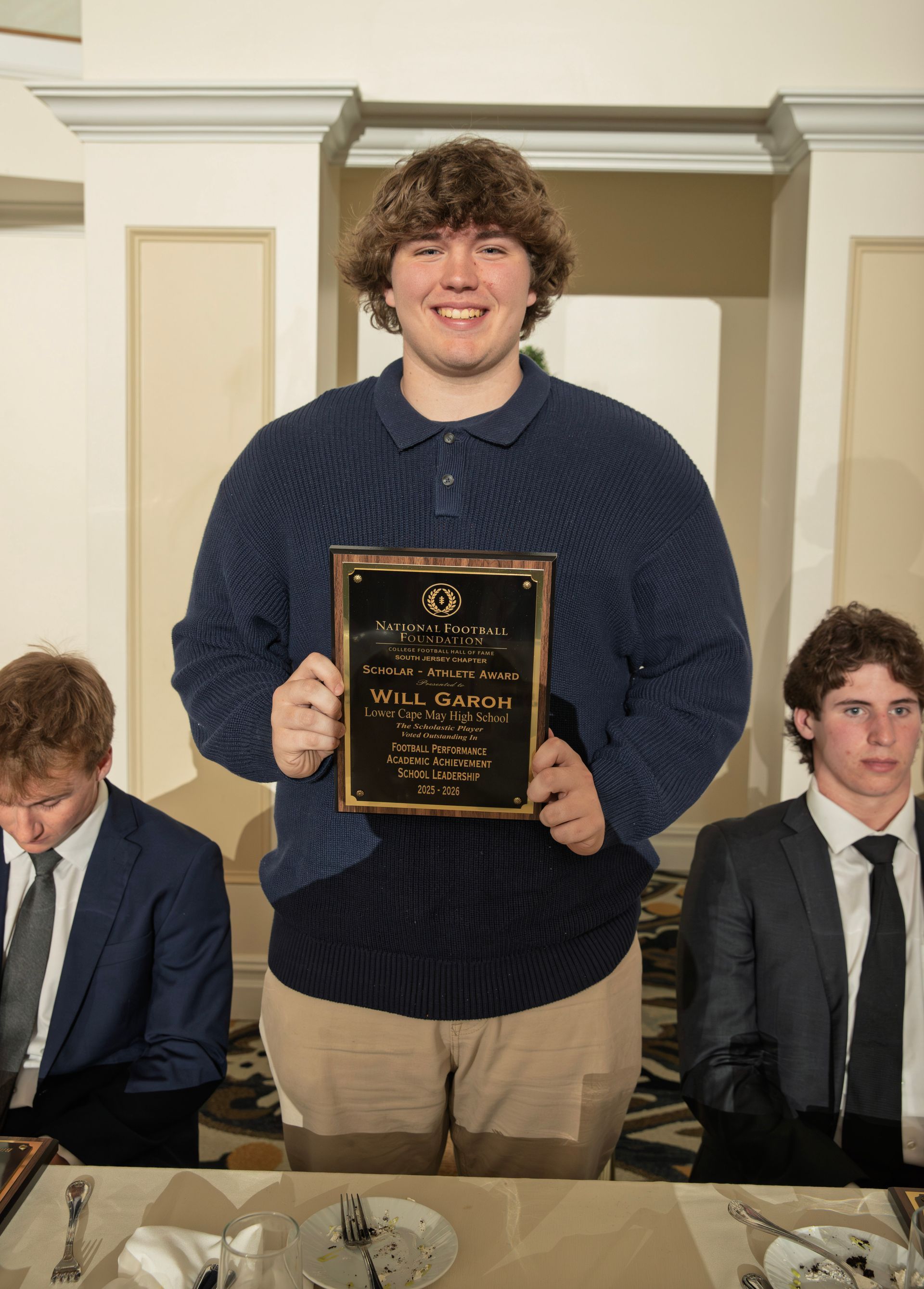 Will Garoh from Lower Cape May Regional High School holding scholar-athlete awards plaque from NFFSJ