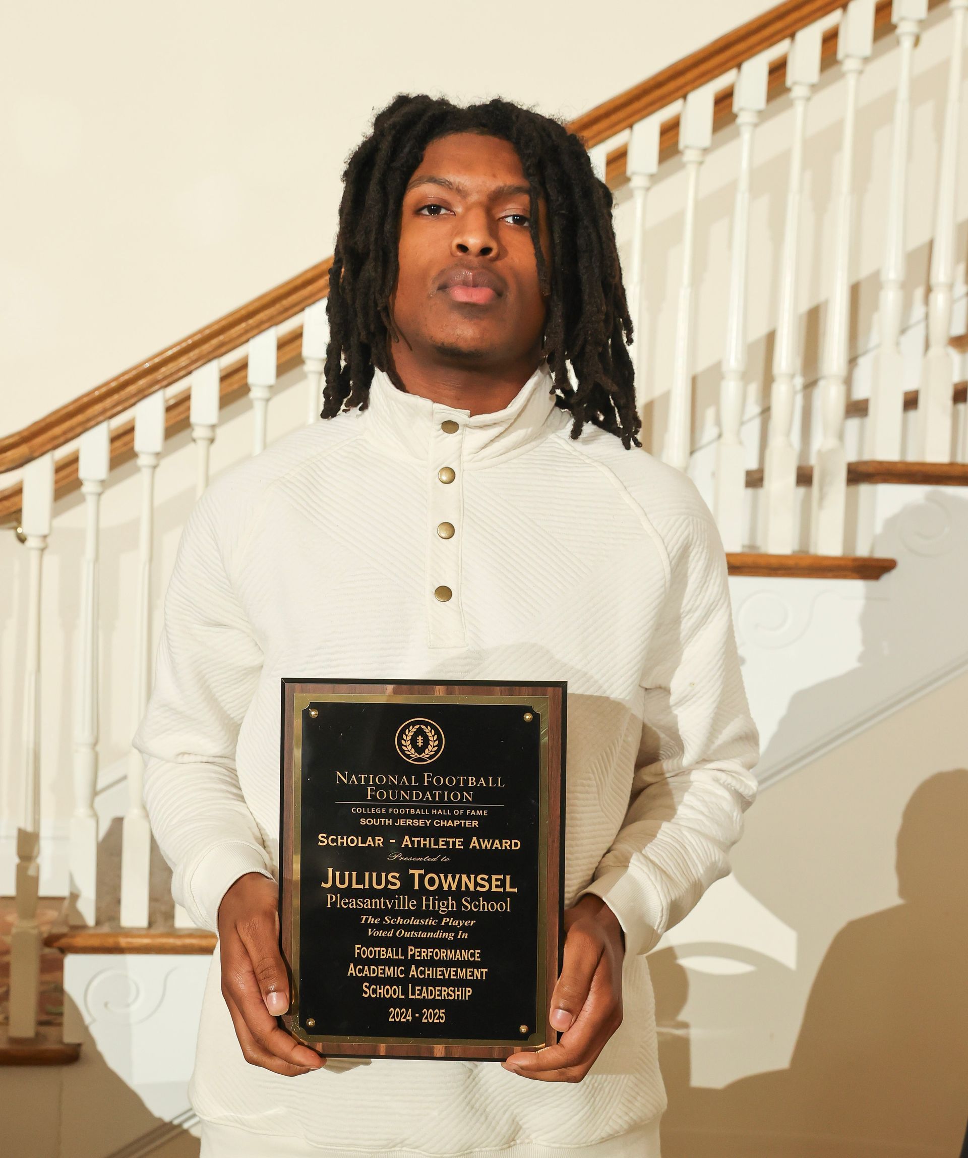 julius townsel of pleasantville high school holding an awards plaque