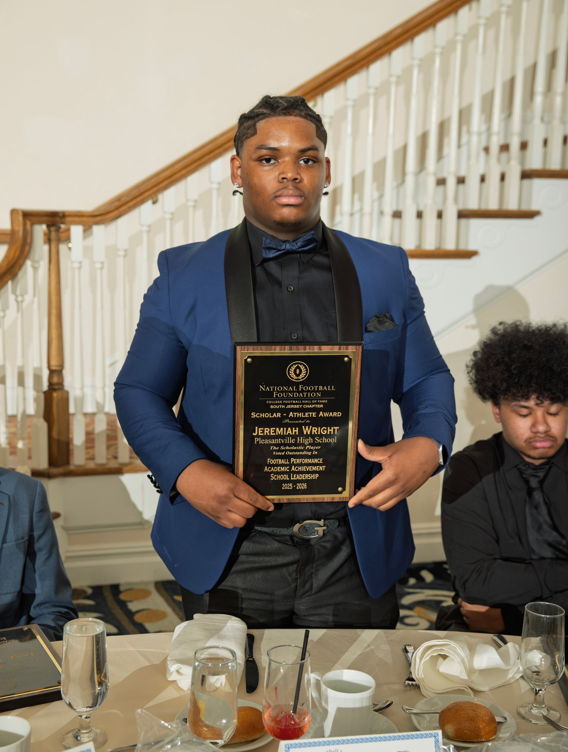 Jeremiah Wright from Pleasantville High School holding scholar-athlete awards plaque from NFFSJ 