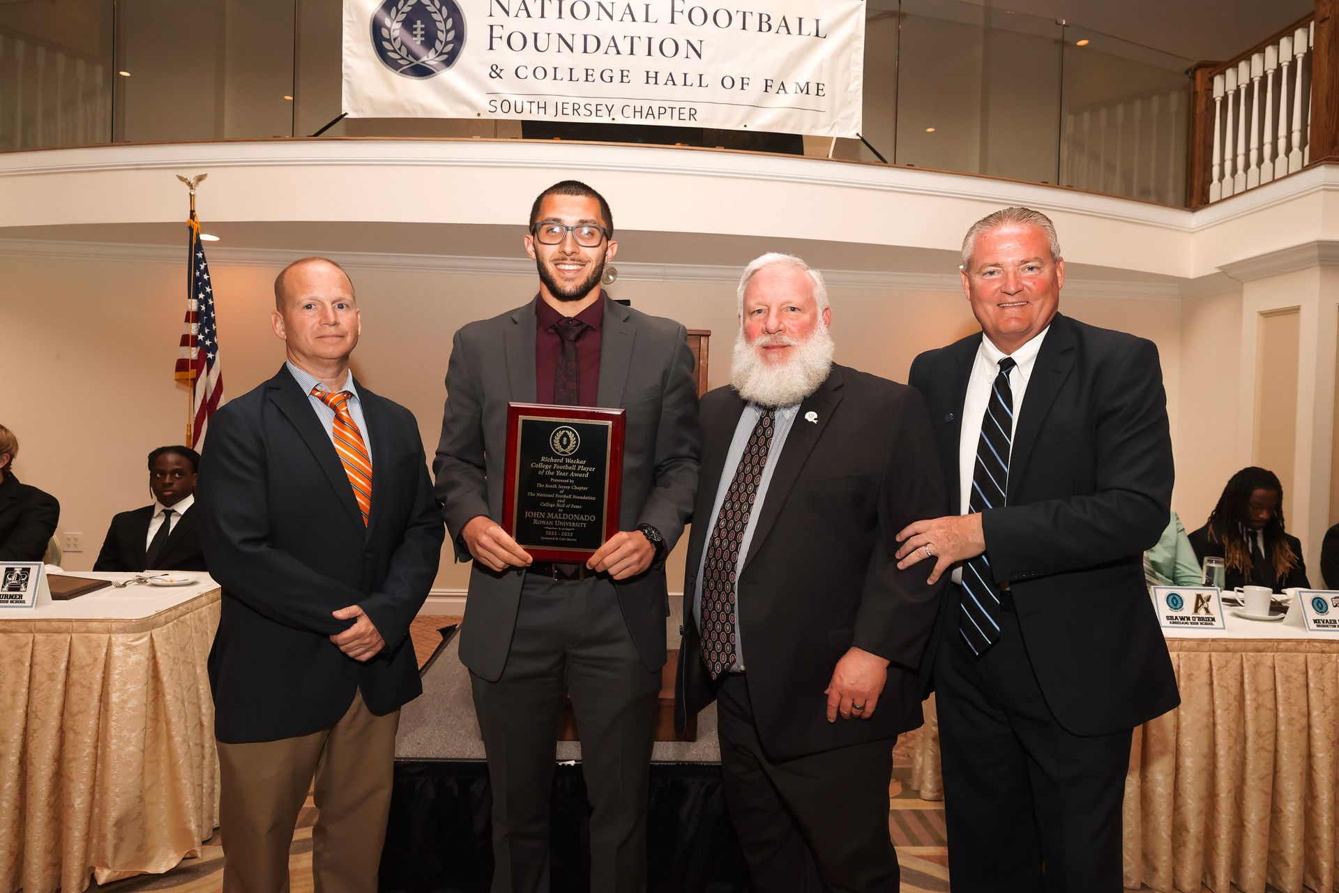 a group of men are posing for a picture in front of a banner that says ' chicago pacific ' on it