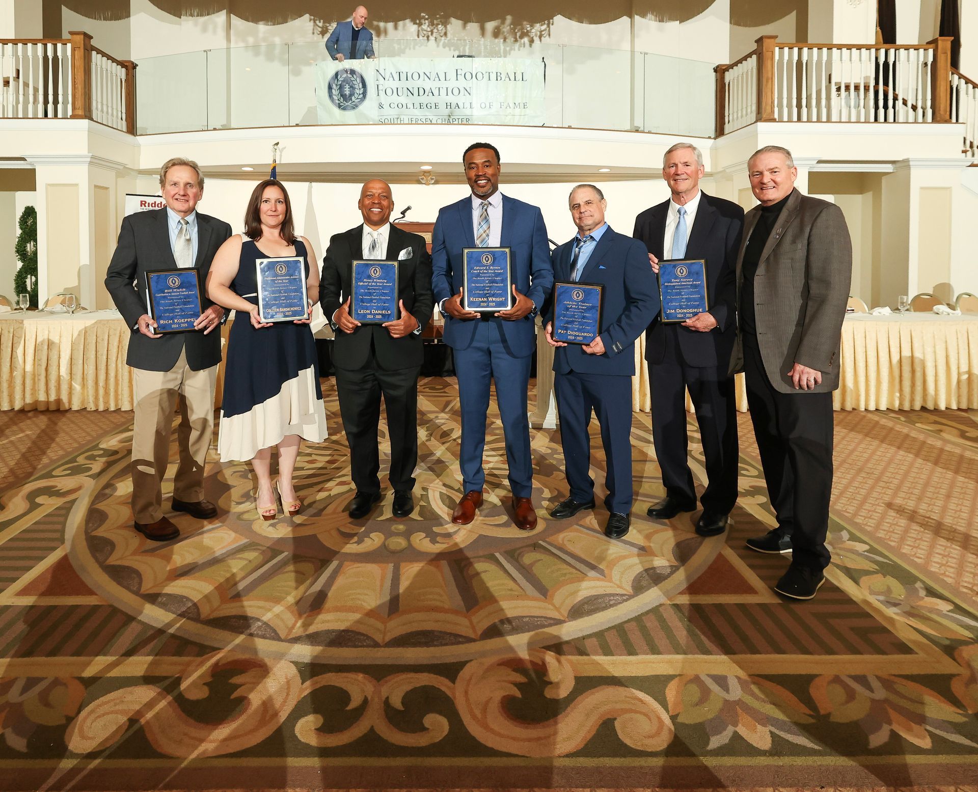 a group picture of the award winners from the south jersey chapter of the national football foundation