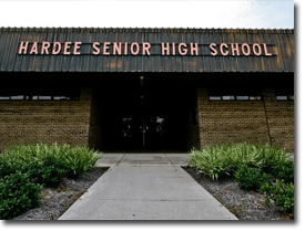 Hardee Senior High School building with brick facade and a sign above the entrance.