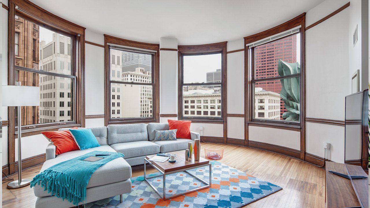 Apartment Living Room with Many Windows at ARC at Old Colony.