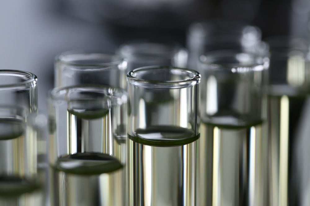 Test tubes filled with clear liquid in a lab setting.