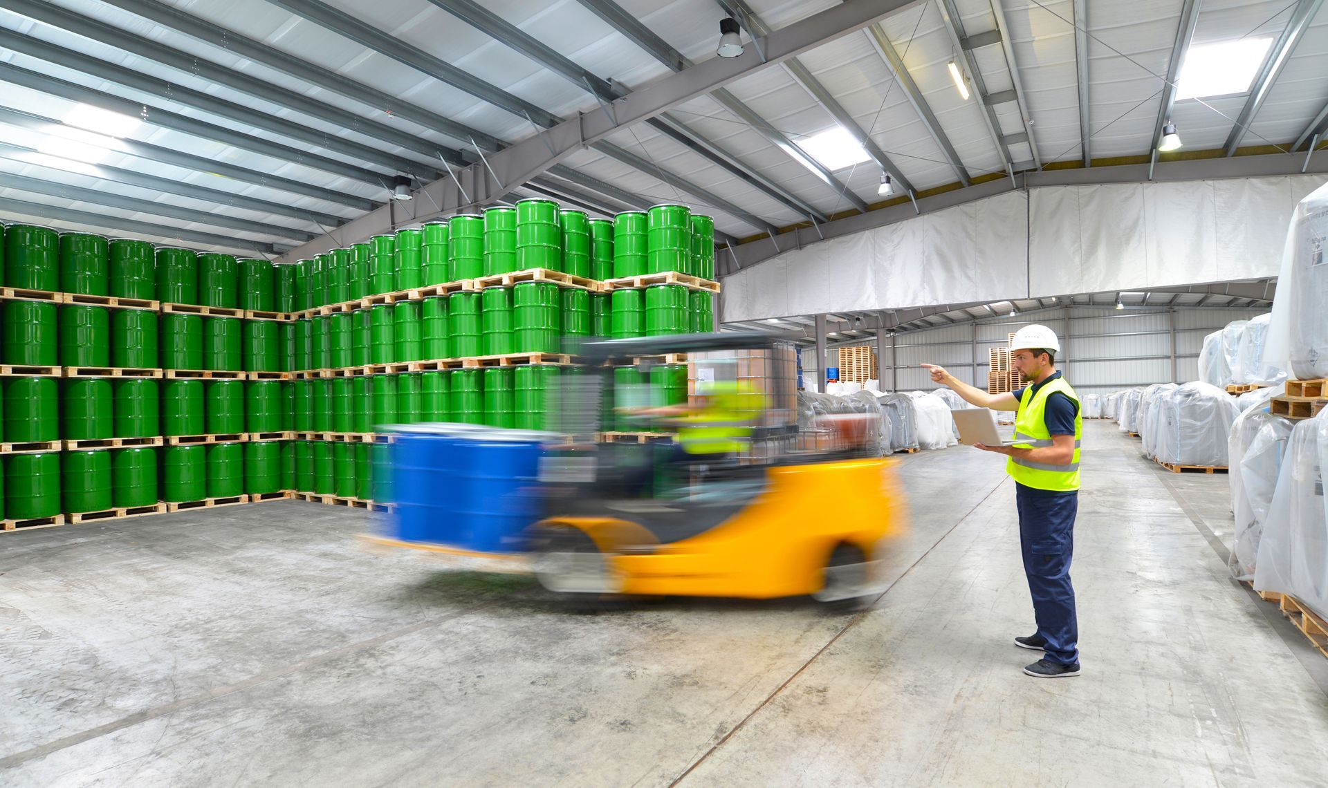 group of workers in the logistics industry work in a warehouse with chemicals | they rely on solvents procurement