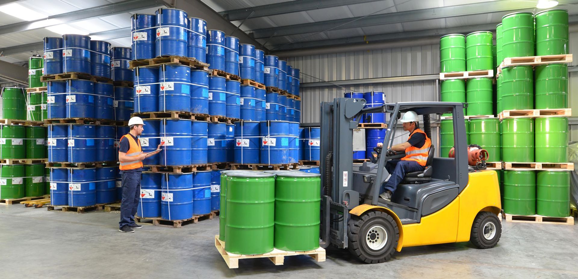 group of workers in the logistics industry work in a warehouse with chemicals | they rely on a specialty chemicals supplier