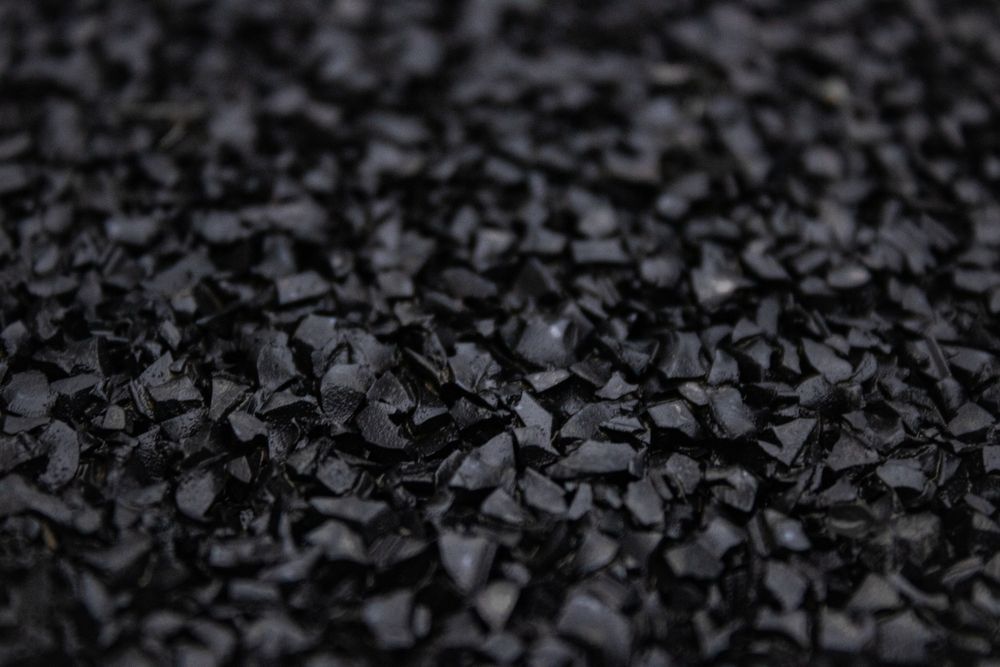 a close up image of black bio-based synthetic rubber pieces